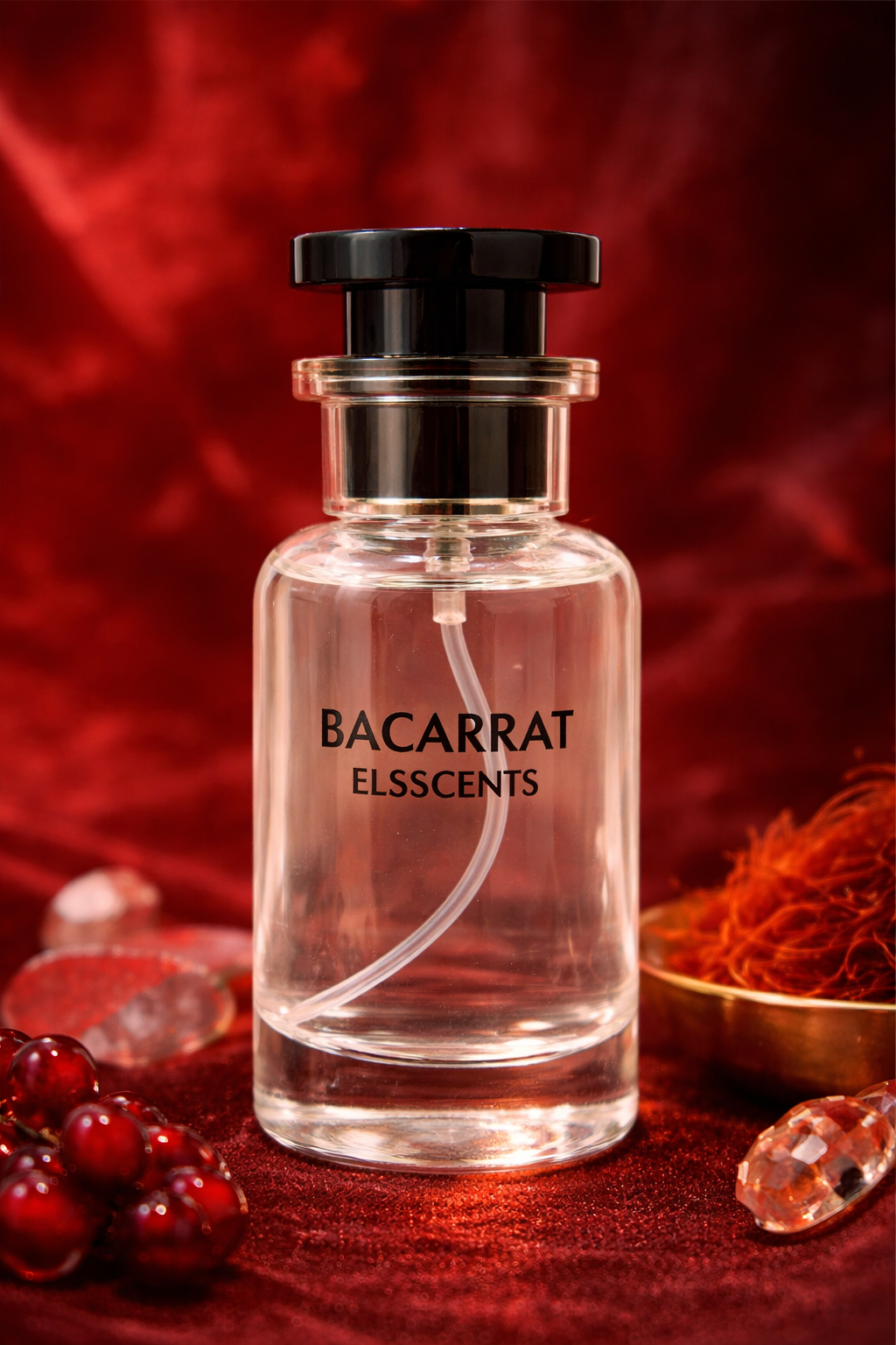 Bacarrat Elsscents perfume bottle on a red background with berries and gold leaf.