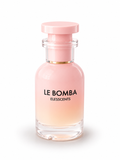 Pink perfume bottle labeled 'Le Bomba' by Elesscents on a white background
